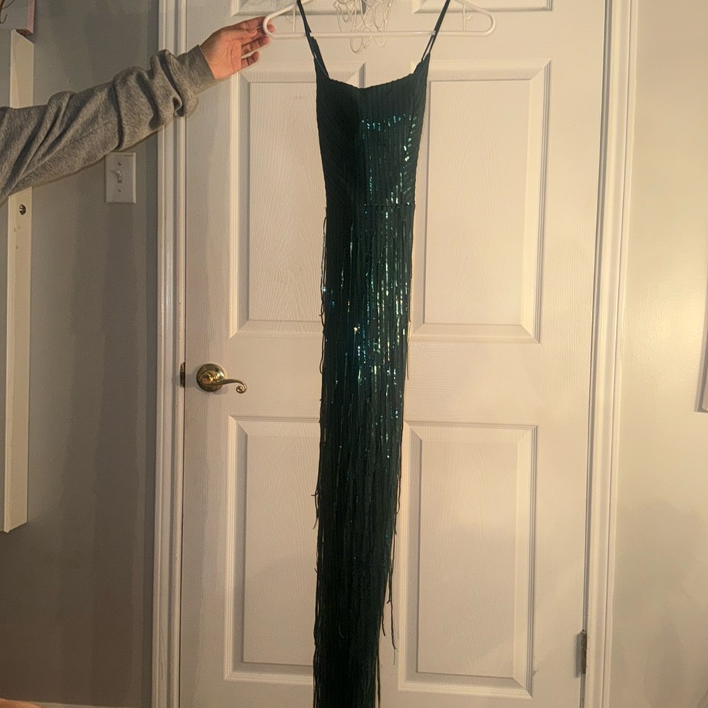 A dark green dark long dress perfect for hoco or prom!